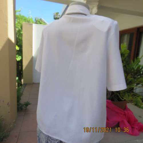 Beautiful short sleeve button down white top with cotton lace both sides.Size 36/12.Shirt collar.