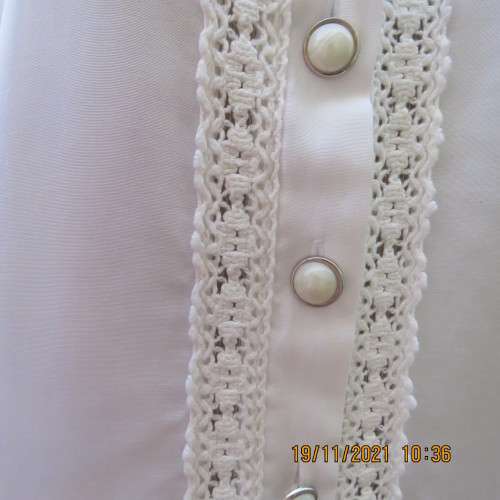 Beautiful short sleeve button down white top with cotton lace both sides.Size 36/12.Shirt collar.