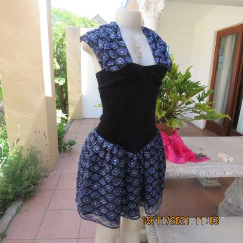 Youthful black velvet dropped waist dress. Acrylic lace,blue,gold skirt and shoulders.Size32 byOTT