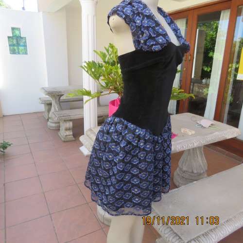 Youthful black velvet dropped waist dress. Acrylic lace,blue,gold skirt and shoulders.Size32 byOTT