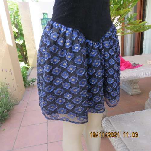 Youthful black velvet dropped waist dress. Acrylic lace,blue,gold skirt and shoulders.Size32 byOTT