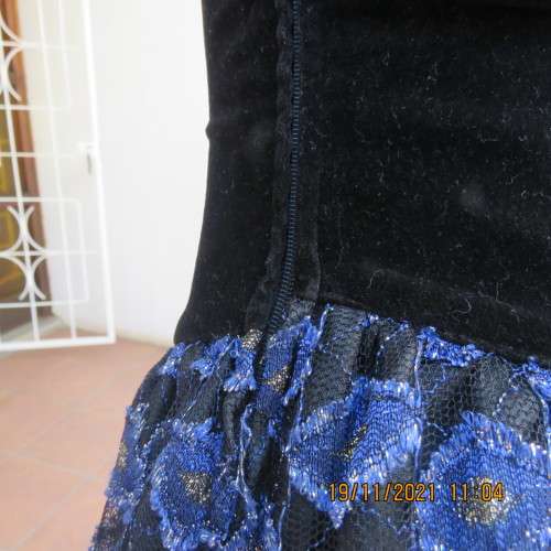 Youthful black velvet dropped waist dress. Acrylic lace,blue,gold skirt and shoulders.Size32 byOTT