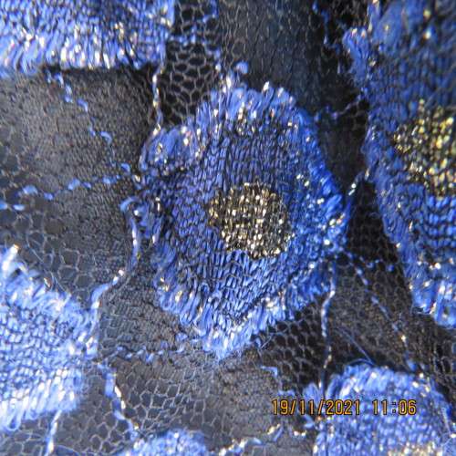 Youthful black velvet dropped waist dress. Acrylic lace,blue,gold skirt and shoulders.Size32 byOTT