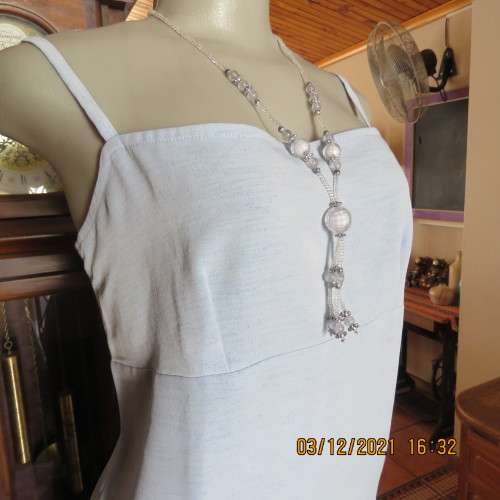 Powder blue empire style strappy top size 34/10 loose fit top in polyester satin.Owner made.As new