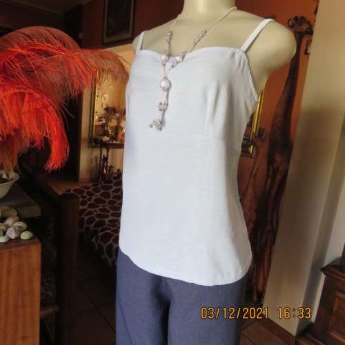 Powder blue empire style strappy top size 34/10 loose fit top in polyester satin.Owner made.As new