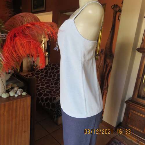 Powder blue empire style strappy top size 34/10 loose fit top in polyester satin.Owner made.As new