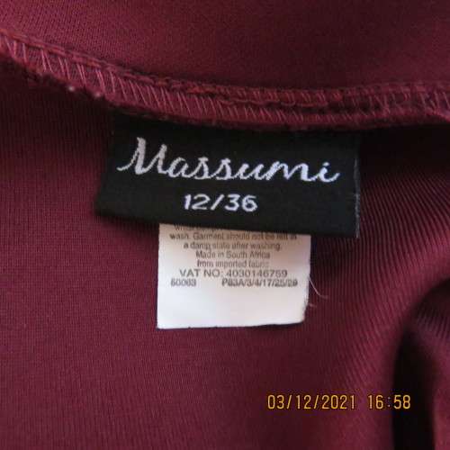 Maroon heavy stretch 100% polyester pencil skirt with slits at sides.Size 36/12 by MASSUMI.As new.
