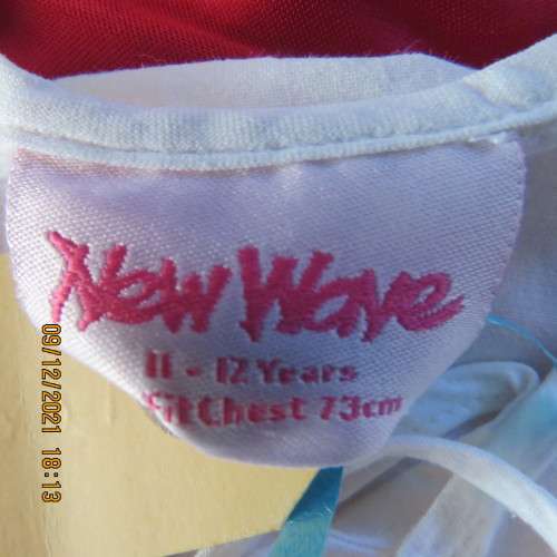 Pretty white slip over round neck top with front slit and tiestring.Patterned neckline.For 11/12 yr.
