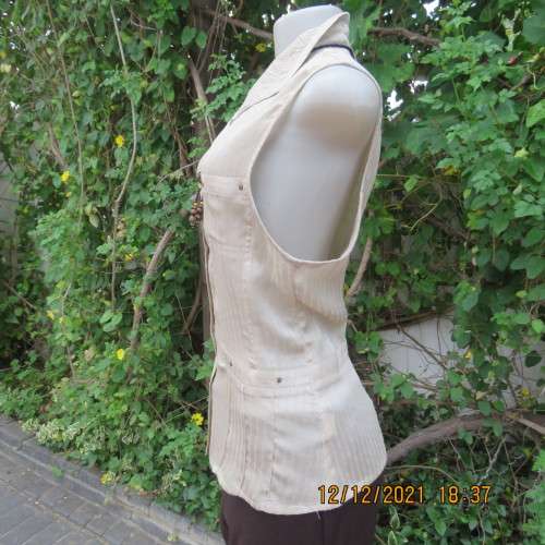Cool sleeveless wheat colour button down top with open collar.Two small pockets.Size 36/12 . As new.
