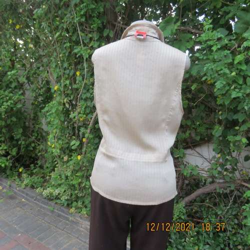 Cool sleeveless wheat colour button down top with open collar.Two small pockets.Size 36/12 . As new.