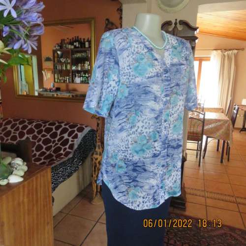 Exquisite 100% rayon CUPID short sleeve top in medley of blues and turquoise.Button down.New cond.