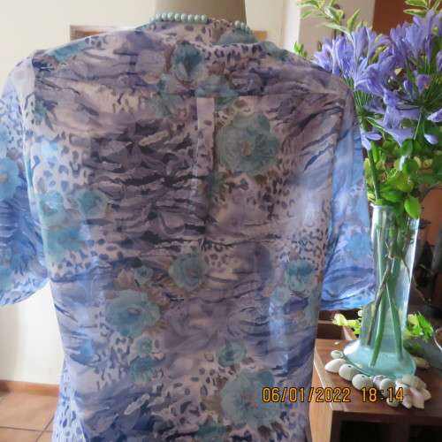 Exquisite 100% rayon CUPID short sleeve top in medley of blues and turquoise.Button down.New cond.