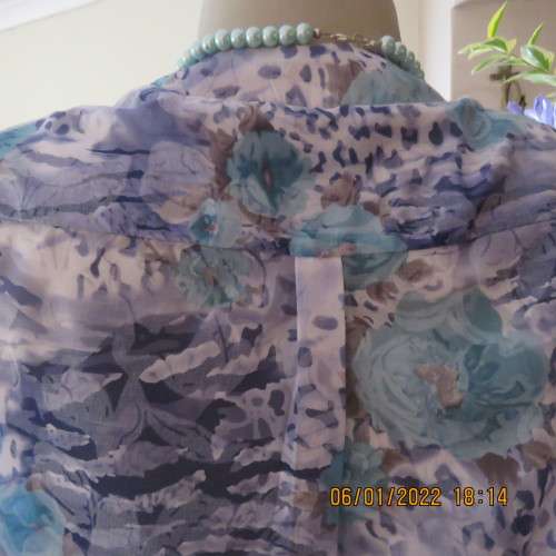 Exquisite 100% rayon CUPID short sleeve top in medley of blues and turquoise.Button down.New cond.