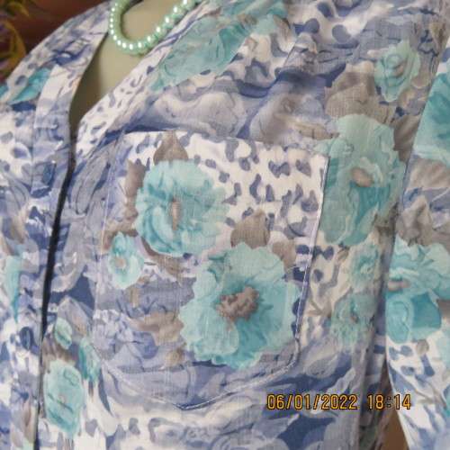 Exquisite 100% rayon CUPID short sleeve top in medley of blues and turquoise.Button down.New cond.