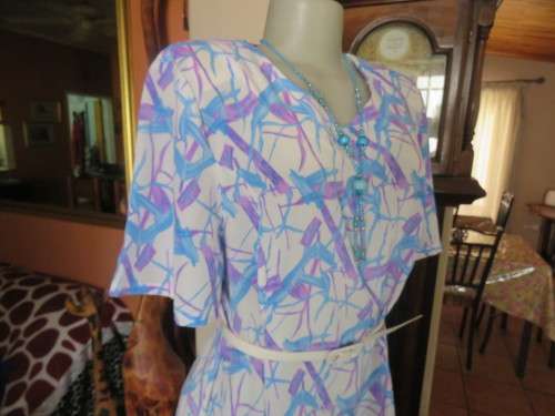 Cool owner made white polyester princess style dress with lilac/blue graphic print.Size 40/16.As new