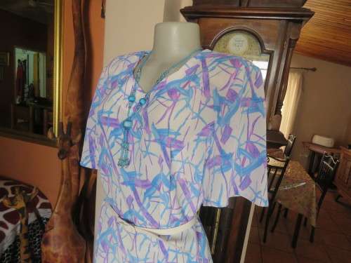 Cool owner made white polyester princess style dress with lilac/blue graphic print.Size 40/16.As new