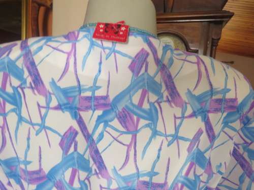 Cool owner made white polyester princess style dress with lilac/blue graphic print.Size 40/16.As new