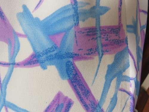 Cool owner made white polyester princess style dress with lilac/blue graphic print.Size 40/16.As new
