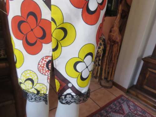 Ethnic look cream dress with bold autumn design.Black long sheer sleeves and yoke.Size 36 by ENVY.
