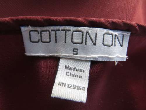 Fabulous maroon COTTON ON size 34/10 top longer at back.Scooped neckline.Luxury poly.As new