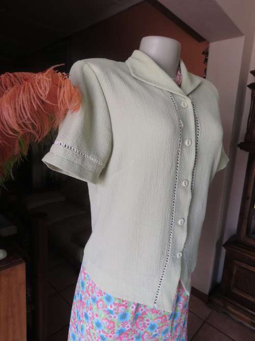 Get bonus fashion points with this mint green button down top/jacket size 36/12 in textured poly.