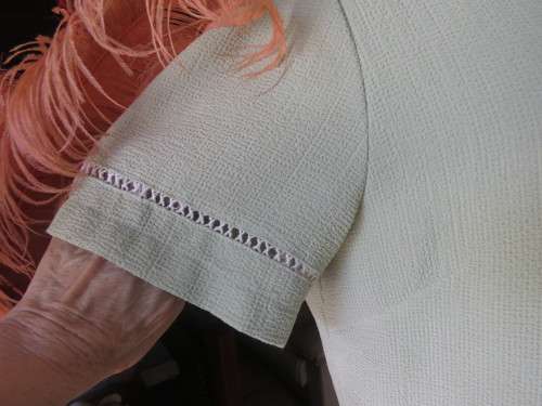 Get bonus fashion points with this mint green button down top/jacket size 36/12 in textured poly.
