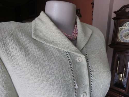 Get bonus fashion points with this mint green button down top/jacket size 36/12 in textured poly.