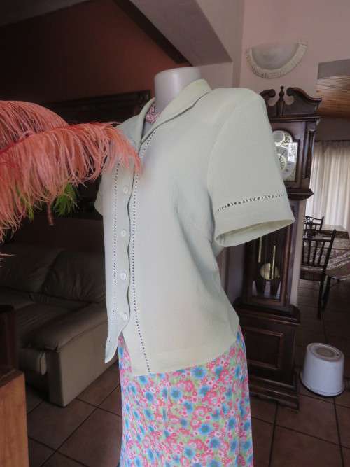 Get bonus fashion points with this mint green button down top/jacket size 36/12 in textured poly.