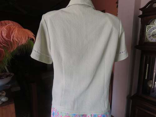 Get bonus fashion points with this mint green button down top/jacket size 36/12 in textured poly.