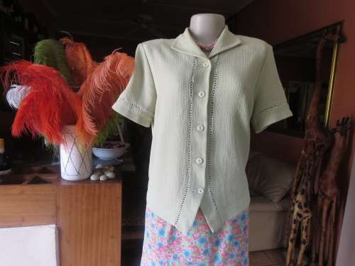 Get bonus fashion points with this mint green button down top/jacket size 36/12 in textured poly.