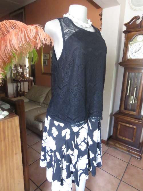 Go feminine with this sleeveless black acrylic lace slip over top.Underlay in stretch poly.Size 36