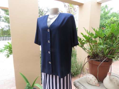 Elegant short sleeve navy box style jacket/top.V neck with button down front.By SOFT BLOUSE size 40.