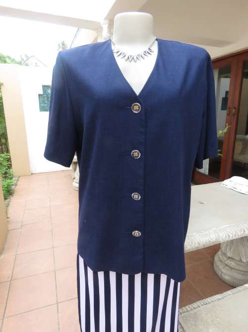 Elegant short sleeve navy box style jacket/top.V neck with button down front.By SOFT BLOUSE size 40.
