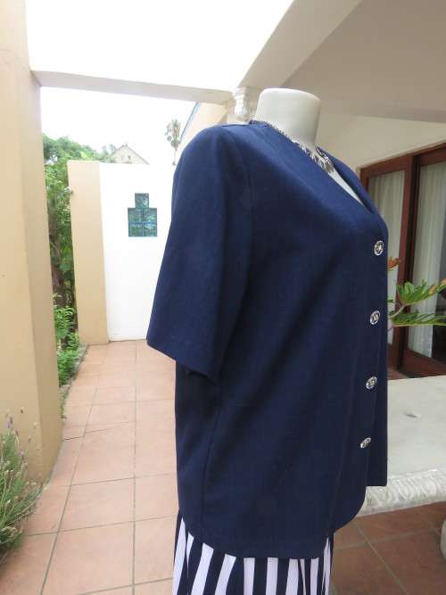 Elegant short sleeve navy box style jacket/top.V neck with button down front.By SOFT BLOUSE size 40.