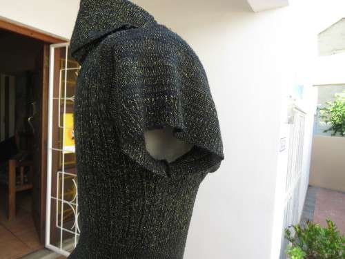 All that glitters!! Black acrylic knitted capped sleeve top with gold thread.Amazing collar.Size 38