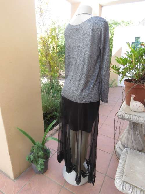 Glitter long sleeve slip over top in polyester,viscose,metalic silver.Size 36 to 38 by H+M As new