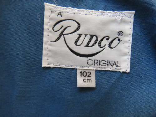 As new original RUDCO light weight steel blue chesterfield button down coat size 38/14.With belt.