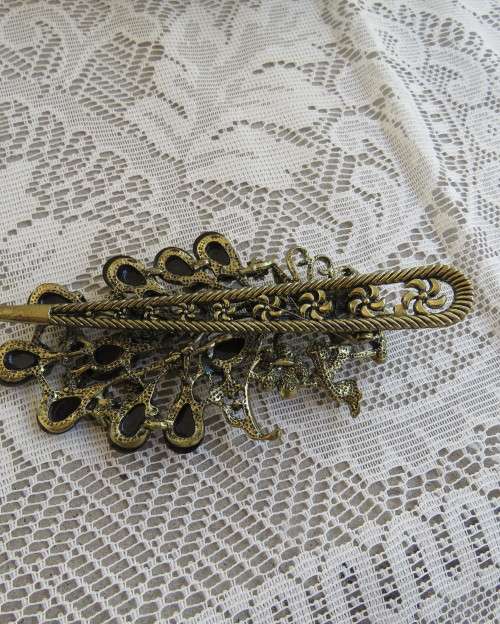 Amazing peacock design hairclip with purple stones and antique gold metal clip. New