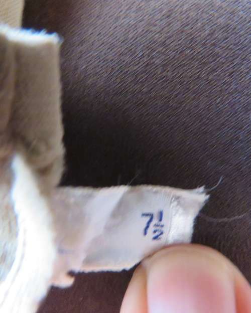 Pair of vintage wheat colour ladies gloves in size 7.5 with decoration on wrist. Good condition.