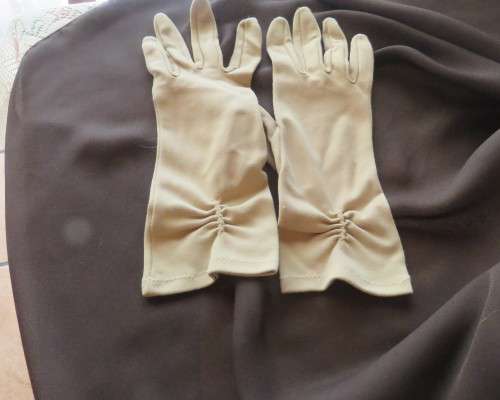 Pair of vintage wheat colour ladies gloves in size 7.5 with decoration on wrist. Good condition.