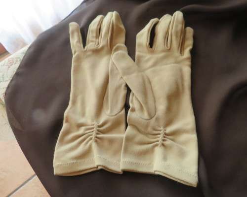 Pair of vintage wheat colour ladies gloves in size 7.5 with decoration on wrist. Good condition.