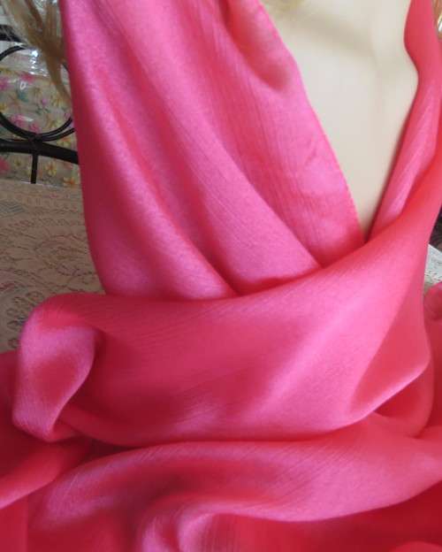 Silky,shiny magenta pink scarf in polyester fabric. Size 175cm x 53cm. Luxury soft feel. New