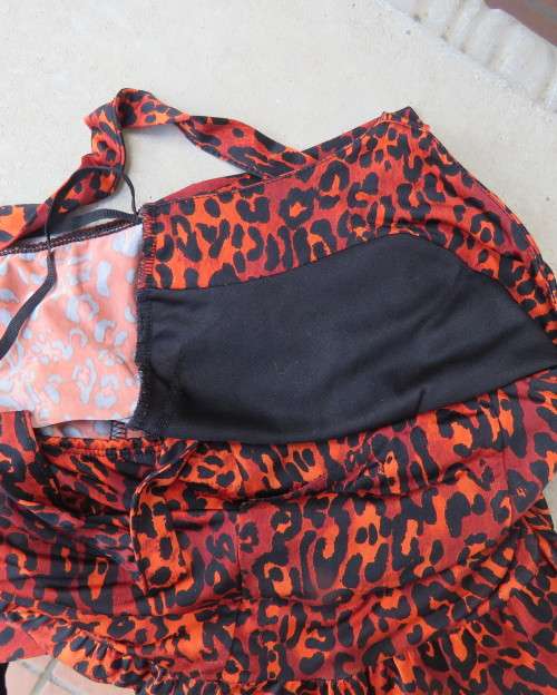 Get noticed in this brick and black high/low animal print poly stretch dress.By WWW size 36.