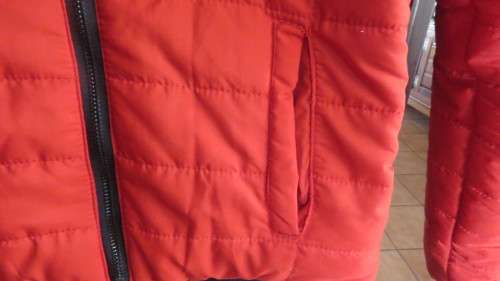 As new red padded long sleeve hooded jacket size 30/6 by RT. Kangaroo pockets.100% polyester.