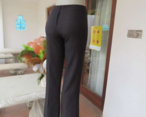 Smart black straight legged dress pants. Bandless with back zip.By SMILEY size 32/8.As new