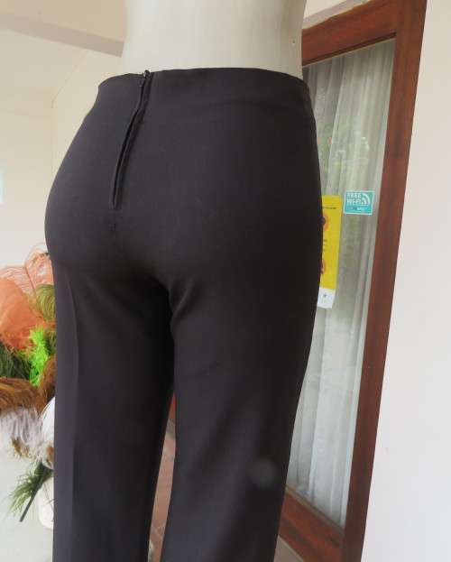 Smart black straight legged dress pants. Bandless with back zip.By SMILEY size 32/8.As new