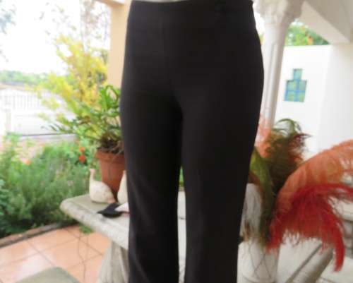 Smart black straight legged dress pants. Bandless with back zip.By SMILEY size 32/8.As new