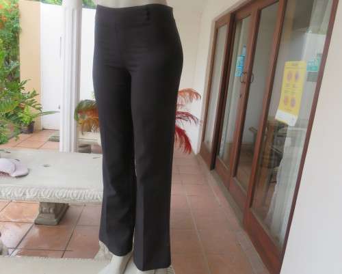 Smart black straight legged dress pants. Bandless with back zip.By SMILEY size 32/8.As new
