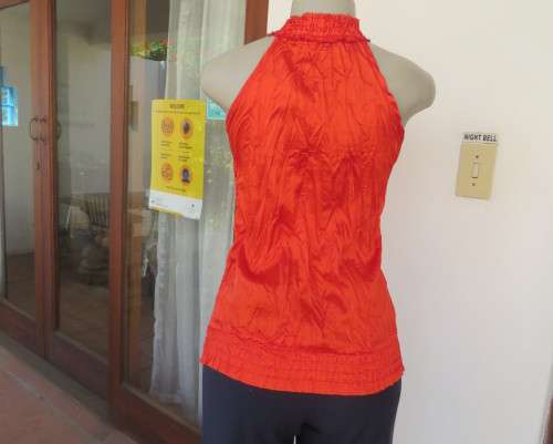 Sweet red silky creased blouson sleeveless top.Wide elasticated seamline.Size 30/6 by IQ.New cond.