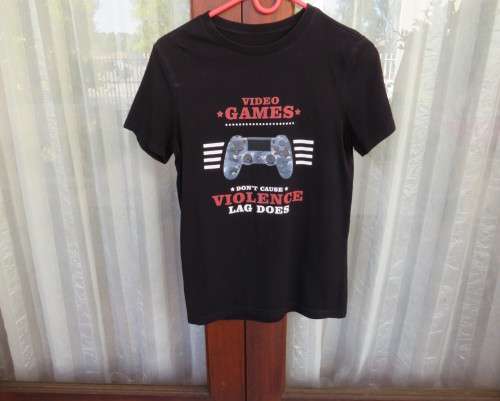 Handsome black 100% cotton short sleeve T Shirt for boy 9 to 10 yrs old. Video games Logo.As new.